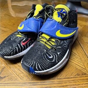 Nike Black Athletic Shoes with Blue and Yellow Accents